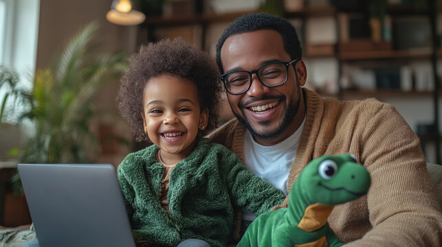 Man and his little daughter looking at laptop.