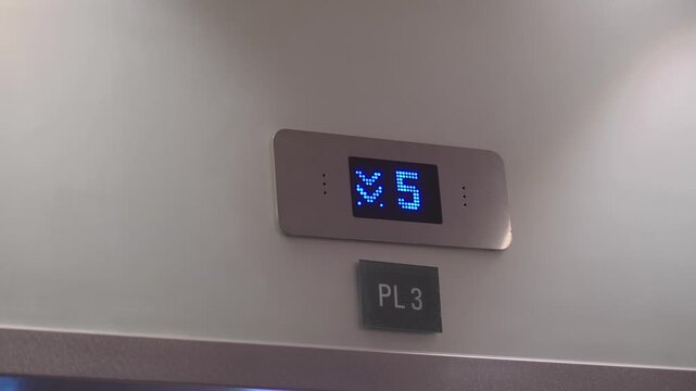 Elevator display shows floor number in a building