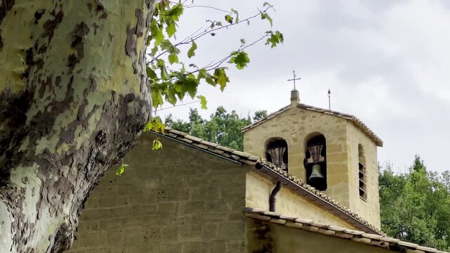 Bell tower of the Romanesque church of Saint-Barthelemy in Vaugines