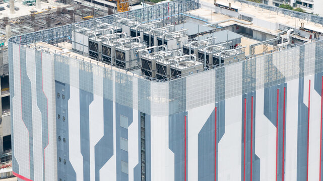 Krung Thep Maha Nakho, Thailand - 21 March 2026: Aerial view of the STT Bangkok 1 data center featuring industrial HVAC cooling units on the roof and a modern geometric facade.