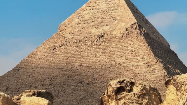 Tilt up and down shot of Pyramid of Khafre Through Ancient Ruins with Cloud Shadow on Stone Texture at Giza Necropolis