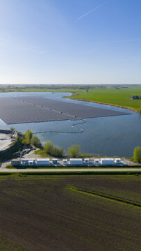 Zwolle, Netherlands - 23 April 2026: Aerial view of Tesla Megapack BESS Next to Floating Solar Park