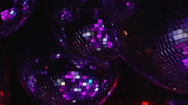 Night comes alive with spectacular birthday party at pulsating disco. Brilliant lights reflect off numerous mirror balls, casting dynamic glow for dancing and celebrating this special occasion.