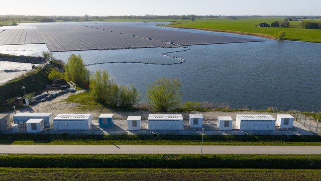 Zwolle, Netherlands - 23 April 2026: Aerial view of Tesla Megapack BESS Next to Floating Solar Park