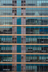 Obraz premium Abstract background of modern glass office building facade with geometric pattern