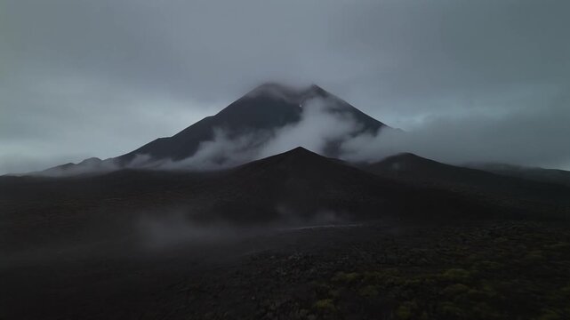 Cinematic view of Taal Volcano under dark misty clouds