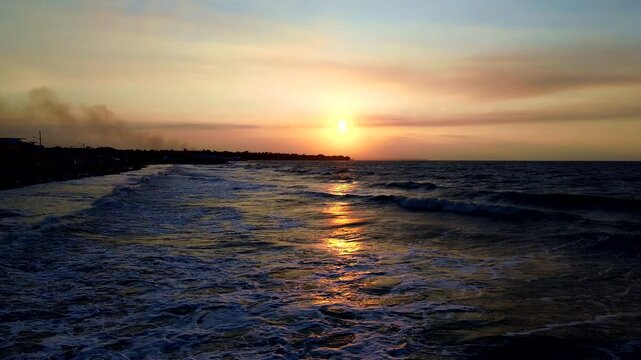 Sunset Waves Along Tropical Ecuador Coastline with Golden Sun Reflection, Dark Beach, Ocean Surf and Scenic South American Seascape Background