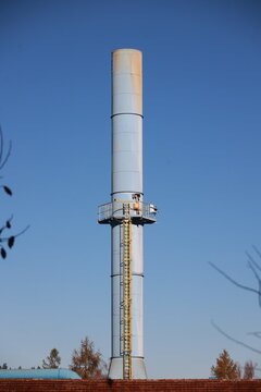 Industrial water pipe against clear blue sky