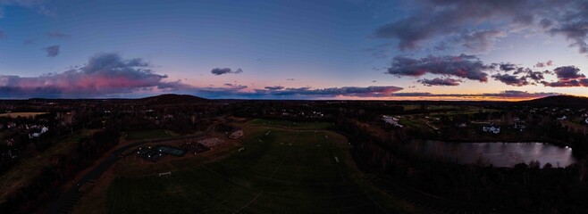 Vibrant Autumn Sunset Over a Suburban Park © Mike