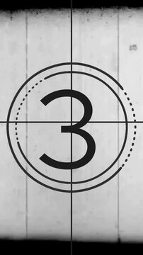 Vintage film countdown leader with numbers changing on screen from one to five with grainy texture and analog aesthetic elements isolated on white background for professional broadcast production tran