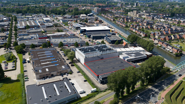 Diemen, Netherlands - 05 June 2026: Aerial view of Switch Datacenters AMS4 surrounded by industrial buildings, warehouses, and a canal in the Netherlands.