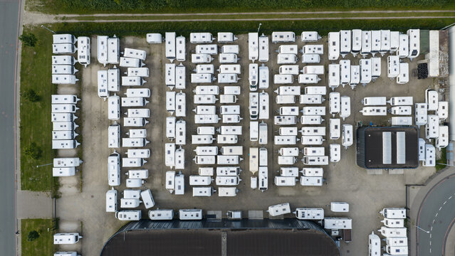 Purmerend, North Holland, Netherlands - 15 June 2026: Aerial view of a large storage lot filled with rows of white caravans and campers parked in an organized grid pattern.