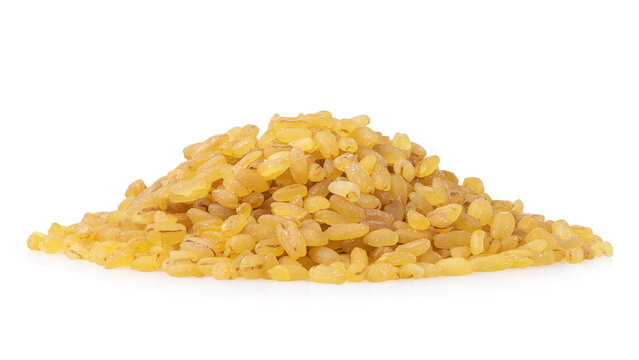 Pile of dry bulgur wheat groats isolated on white background, close-up side view