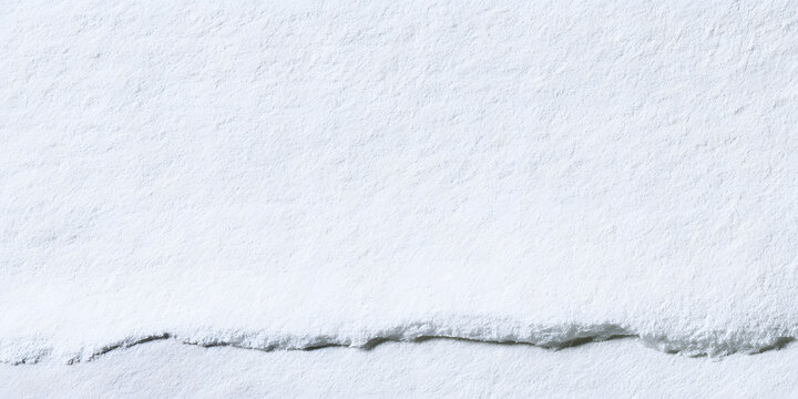 A white paper with a watercolor texture and a rough surface, ideal for an artistic project, drawing, or stationery design. The background should be grainy and blank, suitable for minimalist backdrops 