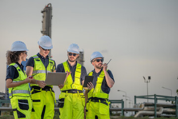 Fototapeta premium inspector workers refinery engineers inspection team petroleum check petrol supervision industry industrial engineer coordinate field operation using laptop tablet and radio communication system