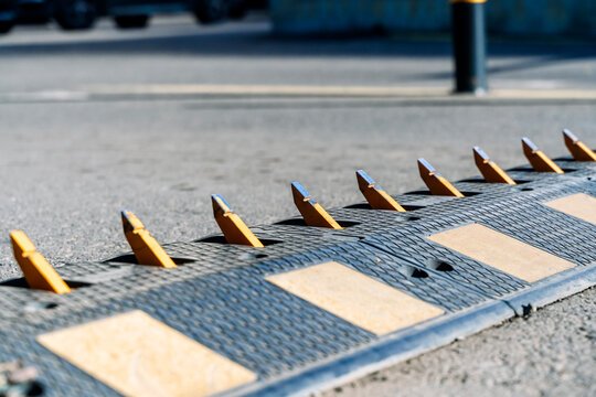 Traffic control tire killer spikes on an asphalt road