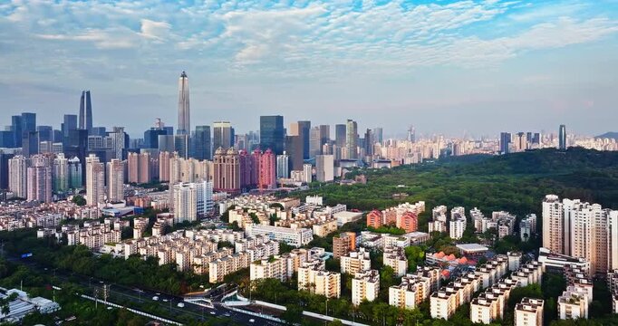 Impressive cityscape of a modern financial district with skyscrapers and urban park in Shenzhen, China