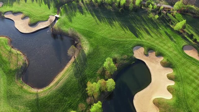 Golf course landscape with green grass and sand traps