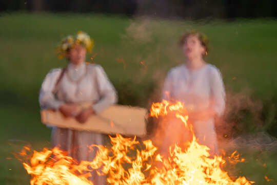 Traditional Latvian Midsummer Bonfire Prepared for Jāņi and Līgo Celebration in Rural Landscape