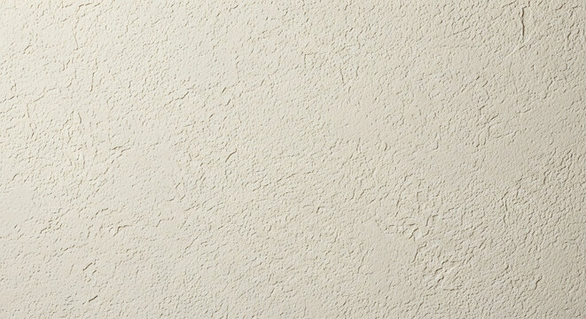 Close up of a beige wall with rough plaster texture and uneven surface finish in natural light