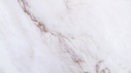Obraz premium Polished white marble surface with soft brown vein pattern background
