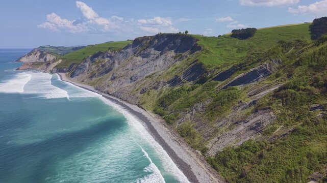 Rocky coastline and green cliffs aerial landscape. Flysch Begiratokia - Baratzazarrak. Deva, Gipuzkoa, Spain.
