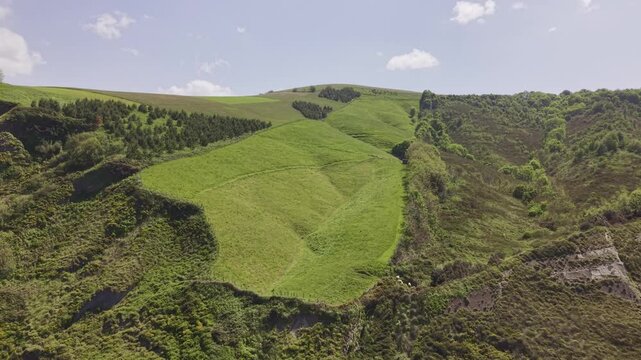 Aerial view of green hills and mountain landscape. Flysch Begiratokia - Baratzazarrak. Deva, Gipuzkoa, Spain.