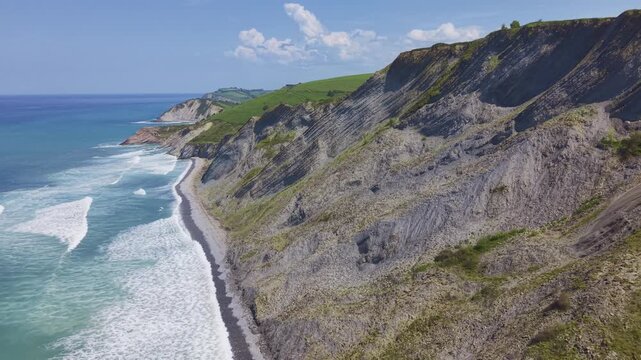 Rocky coastline and green cliffs aerial landscape. Flysch Begiratokia - Baratzazarrak. Deva, Gipuzkoa, Spain.