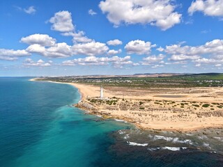 Obraz premium Faro de Trafalgar, aerial view of the lighthouse at a sandy headland with dunes between Los Caños de Meca and Zahora, Conil de la Frontera, Vejer de la Frontera, Costa de la Luz, Andalusia, Spain