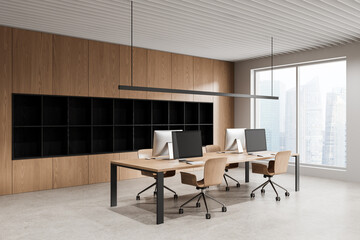 Fototapeta premium Modern open office interior with wooden desks, minimalist chairs, large windows and city view creating a clean workspace environment. 3D Rendering
