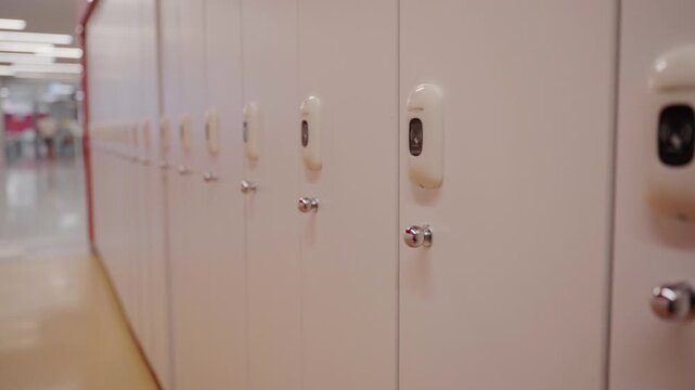 Row of school lockers in an empty hallway