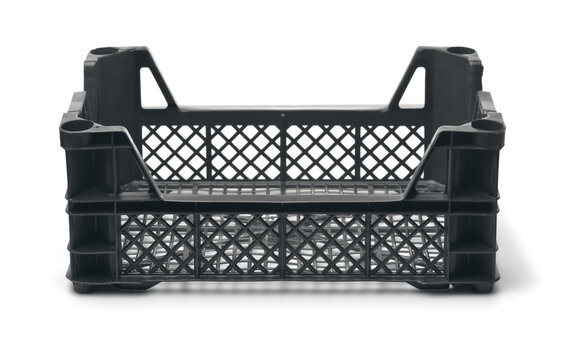 Empty black plastic vegetable crate isolated on white