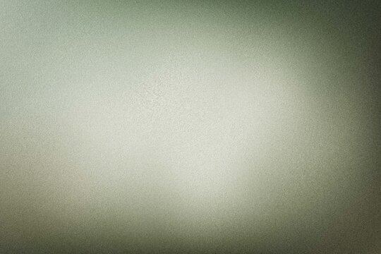 Bright center light on muted olive green frosted glass texture