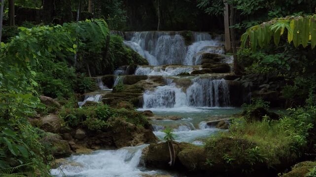 Lush Tropical Rainforest Waterfall Cascading Over Limestone Tiers In Huai Mea Khamin Waterfall Kanchanaburi Thailand