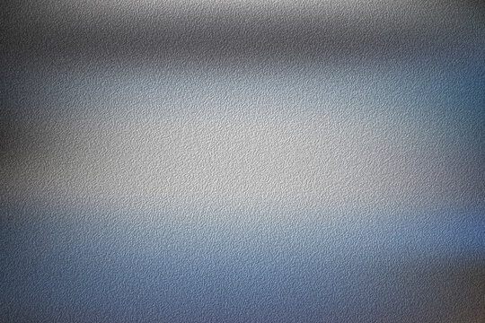 Abstract dark grey textured background with soft blue light wash