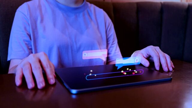 A person using a tablet to engage in social media chat with digital hologram bubbles and heart icons, representing online communication, modern digital connection, and social networking lifestyle.