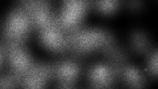 Abstract noise texture with light spots, dark background