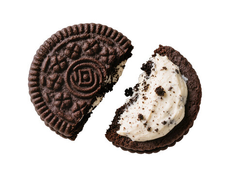 Isolated chocolate sandwich cookie broken in half, revealing delicious creamy filling and crumbs.