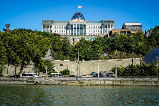 Georgian Presidential Palace Orbeliani overlooking the Mtkvari River under clear blue sky, Tbilisi, Georgia