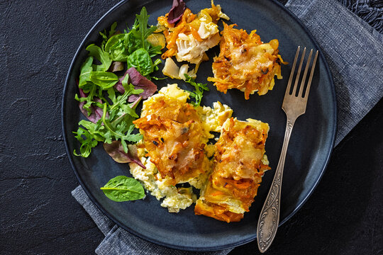 Cheesy Veggie Baked White Fish on a plate