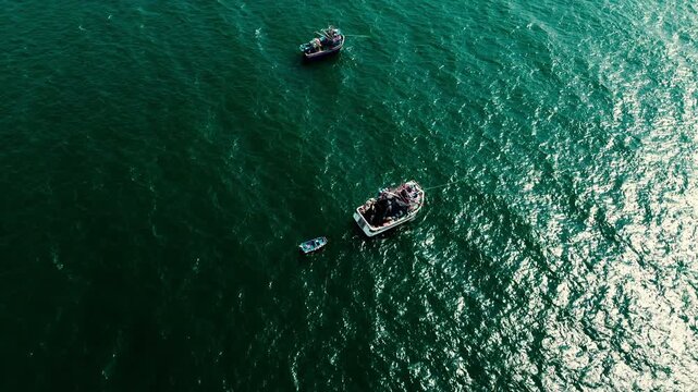 Aerial View of Fishing Boats on Green Blue Pacific Ocean in Ecuador, Sun Reflection, Artisanal Fleet, Coastal Maritime Scene and Seascape Background