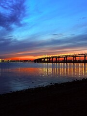Fototapeta premium impressive huge bridge in the sunset sea horizon, fantastic sea horizon
