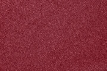 Fototapeta premium Maroon fabric texture background with a soft, woven appearance.