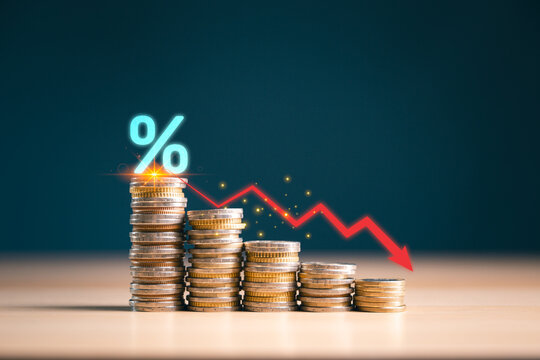 Declining coin stacks with percent symbol and red downward arrow show falling interest rates, financial loss, recession risk, market downturn, savings decline and economic crisis concept.