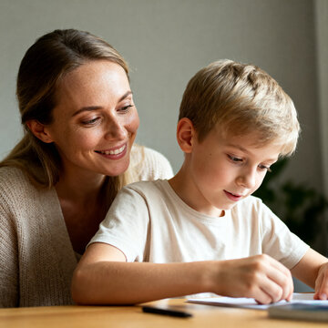 Female child therapist with kid boy