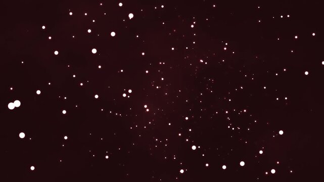 Glowing white particles drift slowly through a deep dark void in this high quality motion animation clip that captures the ethereal beauty of stardust floating within the vast cosmic expanse.