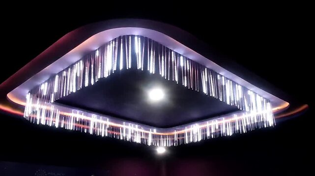 The interior decoration of the ceiling is decorated with vertical LED decorative lights against a dark background