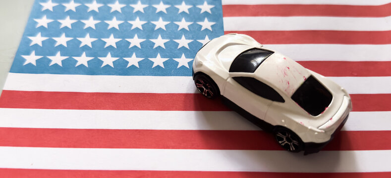 patriotic toy car resting on an american flag side view playful and colorful scene for children's toys educational resource web banner poster design visual story.