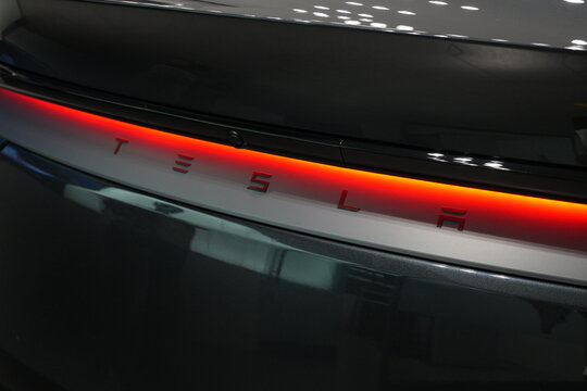 A close up of the red LED taillight on a Tesla car.