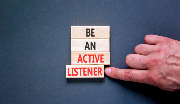 Be an active listener words symbol. Concept words Be an active listener on beautiful wooden blocks. Beautiful grey background. Businessman hand. Business be an active listener concept. Copy space.